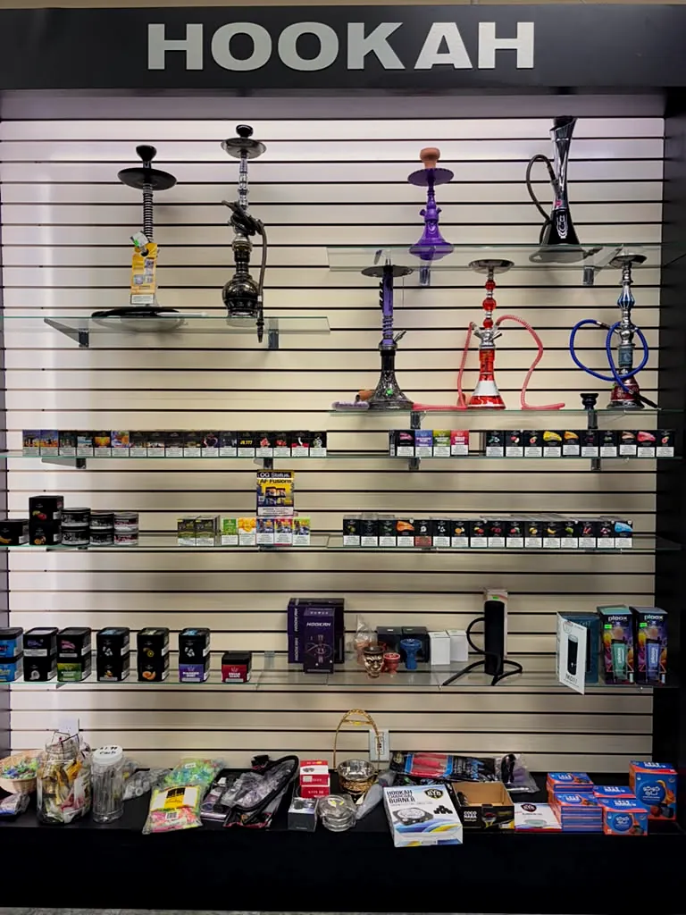 Hookah wall with hookahs and accessories at Way~Up Smoke