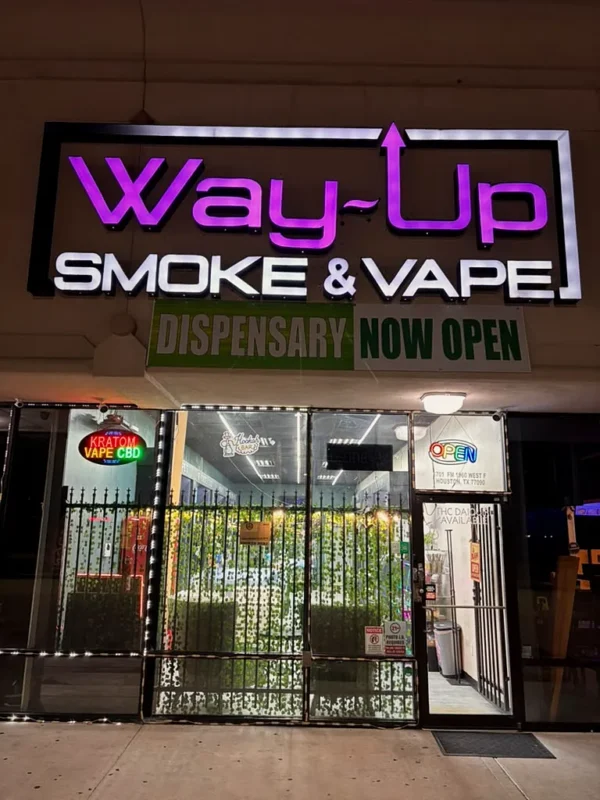 Way~Up Smoke storefront on FM 1960 W in Houston at night