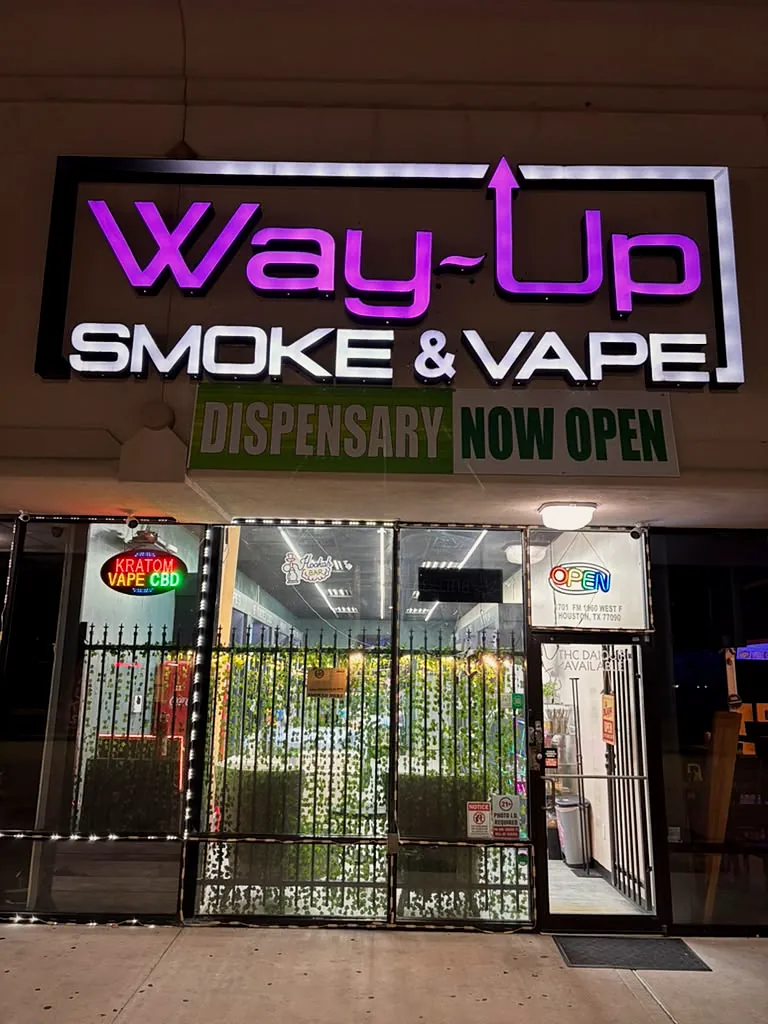 Way~Up Smoke storefront on FM 1960 W in Houston at night