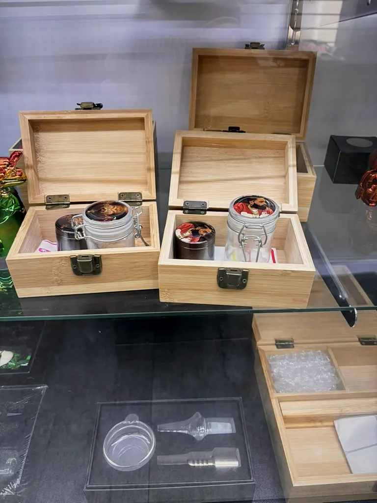 Wooden stash boxes and grinders on display